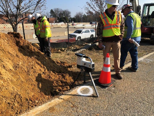Team working on underground utility lines installation and mapping